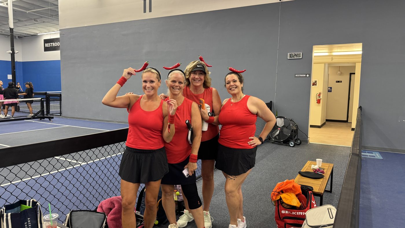 Queens of the Court team in red uniforms